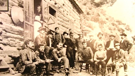 Black and White Old Photo - Miners posing in the front of a lodge